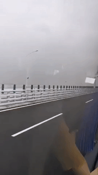 First People Travel Across World's Longest Sea-Crossing Bridge