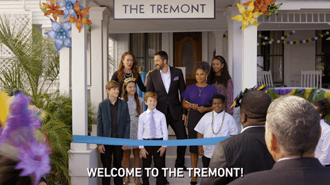 Disney gif. The cast of Secrets of Sulphur Springs are welcoming guests to the grand opening of their hotel, The Tremont. They cut ribbon and say, "Welcome to the Tremont!"