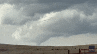 Funnel Cloud Hovers Over Windmill Farm