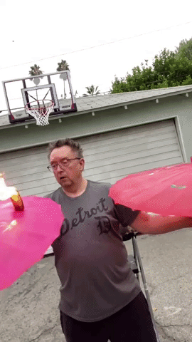 Juggler Uses Flaming Cheeseburger in Party Trick