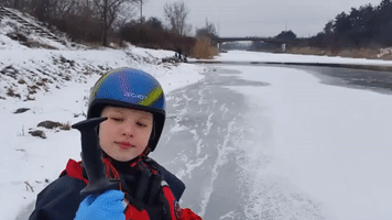 Polish Man Teaches 10-Year-Old Girl to Be Safe on Ice