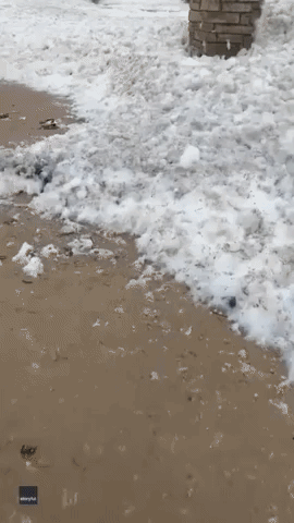'Next Level' Sea Foam Blankets Irish Beach Following Storm Franklin