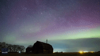 Aurora Dances Above Farmhouse in Manitoba