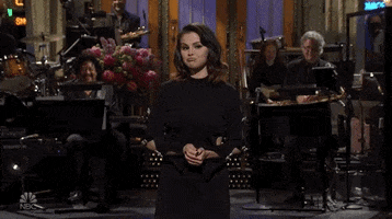 Selena Gomez Shrug GIF by Saturday Night Live