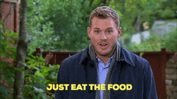 Reality TV gif. Colton from The Bachelor is being interviewed and he looks appalled as he says, "Just eat the food!"