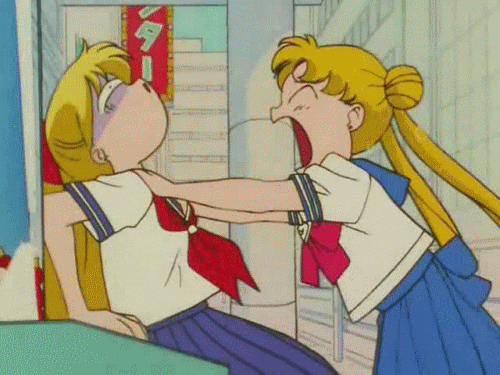 Anime gif. Sailor Venus furiously shakes Sailor Moon by the neck while screaming in her face. Sailor Moon's face is turning a little blue, but she is helpless to her sister's rage.