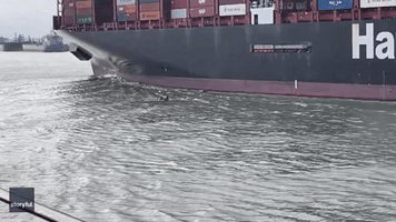 Dinghies in Close Call With Cargo Ship