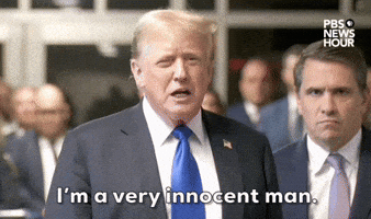 Video gif. Former President Donald Trump speaks in the hallway of a New York courthouse with his lawyer Todd Blanche behind him after being convicted in his hush money trial. He furrows his brows and cocks his head as he defensively says "I'm a very innocent man." 