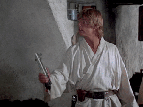 Movie gif. Mark Hamill as Luke Skywalker standing and staring with wide eyes to the side as he engages and disengages in a continuous loop.