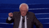 Political gif. Bernie Sanders at the Democratic National Convention leans over a microphone and points out at the crowd. He laughs as he nods his head and then gives a quick thumbs up, laughing harder.