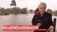 Cameraman Drops Camera to Run to Help People Fleeing Hurricane Ian