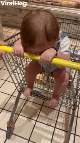 Baby Keeps His Head Down in Supermarket