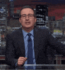TV gif. John Oliver on Last Week Tonight sits at his desk and stares straight at the camera with a bored expression. He says, “cool” in a sarcastic, mocking manner.