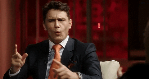 Movie gif. James Franco as Dave Skylark in The Interview frowns and points his fingers at someone as he says, "wait ...." and then shakes his head, confused.