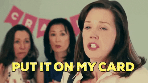 A woman is saying the words, "PUT IT ON MY CARD."