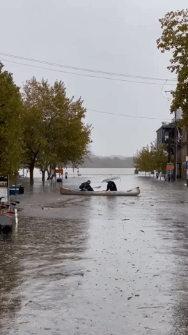 Couple Canoes Through Floodwaters in Alexandria, Virginia