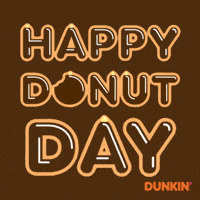 Sponsored gif. Three stacked words that resemble shiny chocolate donuts. Word in the middle slowly disappears as chunks of the word are bitten off. Text reads, “Happy Donut Day.”