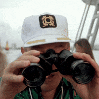 Movie gif. Rodney Dangerfield as Al Czervik in Caddyshack looks up from his binoculars with wide eyes.