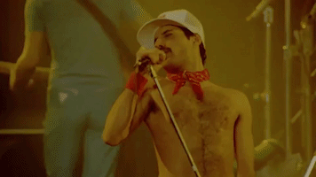 performing freddie mercury GIF