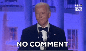 Video gif. President Joe Biden stands behind a podium at the 2024 White House Correspondents' Dinner. He presses his lips together in a grimace and says "No comment" and flashes his hands upwards.
