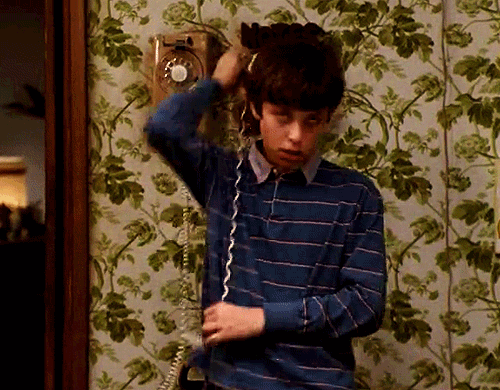 TV gif. John Francis Daley as Sam in Freaks and Geeks. He uses the phone cord and wraps it around his neck and simulates being choked.