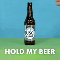 Sponsored gif. Hand comes in from the left and places down a bottle of Busch Light beer. Another hand reaches in from the right and takes the bottle. Text reads, “Hold my beer.”