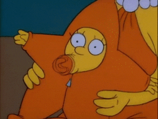 The Simpsons gif. Maggie Simpson sucks hard on her binky with big, wide eyes. She’s dressed in a onesie that makes her look like a big starfish. 