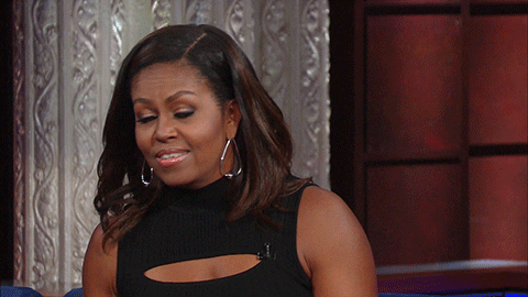 Late Show gif. Michelle Obama on The Late Show with Stephen Colbert looks around looking confused and weirded out by something she just heard. She holds her hands out, shrugging.
