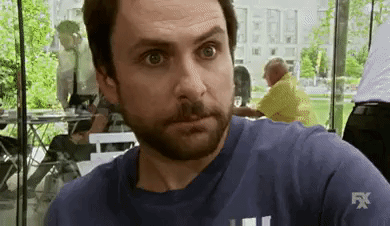 TV gif. Charlie Day as Charlie in It's Always Sunny in Philadelphia rubs his temples as he rolls his eyes as if stressed. 