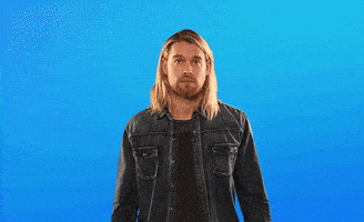 Celebrity gif. Chord Overstreet glancing up and pointing up with both fingers, nodding. Text in background, "This."