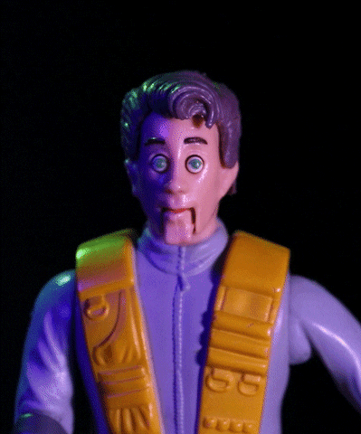 Stop motion gif. Action figure of a man stares at us. His eyes pop out of his head as his jaw drops and his hair pops off of his head. He shakes in fear.