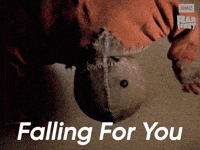 Sponsored gif. Person in a burlap scarecrow mask falls forward and obscures the view. In the upper right corner is the AMC Fear Fest logo. Text reads, “Falling for you.”