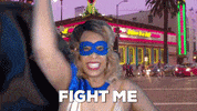 ComedianHollyLogan mask fighting superhero costume GIF