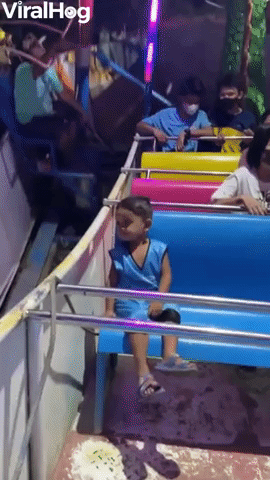 Child Just Chills on Amusement Park Ride   