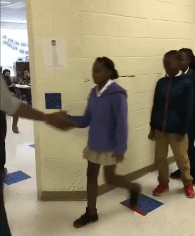 Teacher Shows off Epic Handshakes with Students