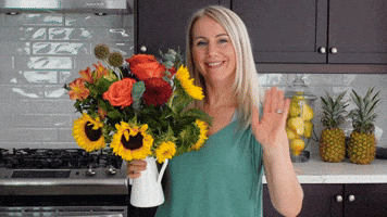 lady waving holding flowers