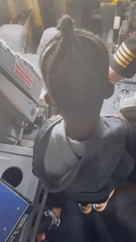 Aspiring Young Pilot Gets Shown the Controls by Captain