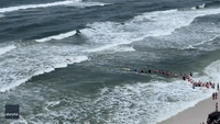 Beachgoers Form Human Chain to Help Swimmers Caught in Rip Current at Florida Beach