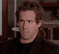 Celebrity gif. Ryan Reynolds looks around with a confused expression, as if searching the room for an answer.