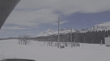 Wind Blows Snow off Mountains in Glacier National Park