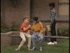 TV gif. Young versions of Joey and Danny from Full House try to be cool as they do a complicated handshake at school as a Black classmate looks on, shaking his head in disgrace.