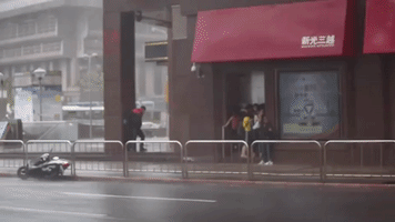 Typhoon Dujuan Sweeps Man Off His Feet