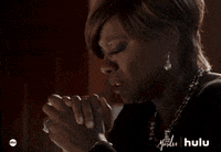 TV gif. Viola Davis as Annalise on How to Get Away With Murder holds her hands together as if she’s praying and looks down with tears streaming from her eyes.