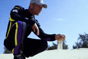 ExtremeELive beach thinking sand xe GIF