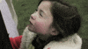 Meme gif. A young girl turns and looks at us with a creepy smirk on her face.