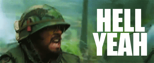 Movie gif. Robert Downey Jr. as Kirk Lazarus from Tropic Thunder wears an army uniform and helmet as he yells: Text, "Hell yeah."