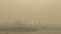 Dense Wildfire Smoke Envelopes Manhattan Cityscape