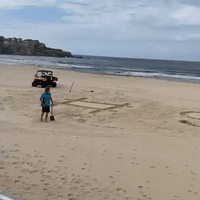 Bondi Lifeguards Write 'Stay Home' in Sand as Beach Closed for Coronavirus Outbreak