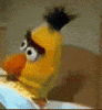 Sesame Street gif. Bert lies in bed, his frown intensifying as he slowly turns to look at us.