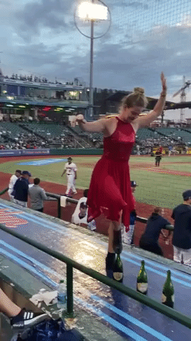 Circus Performer Stuns Player at Baseball Game by Walking Across Wine Bottle Tops